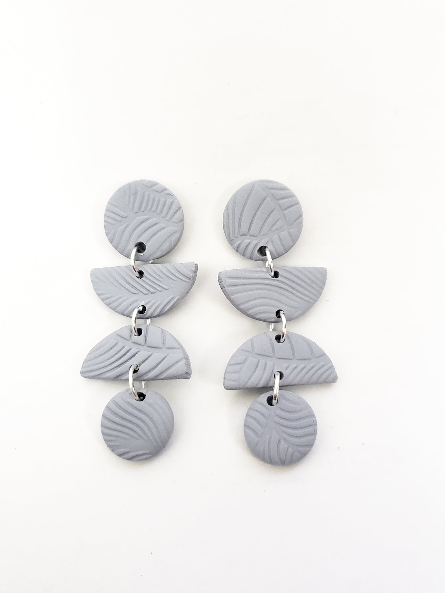 Leafy line textured stud dangles (circle, half circle, half circle, circle) in fog blue