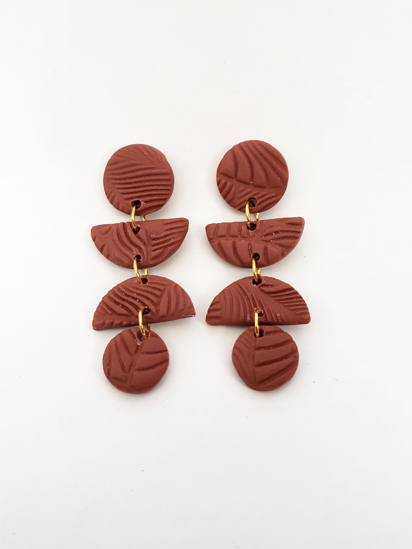 Leafy line textured stud dangles (circle, half circle, half circle, circle) in terracotta