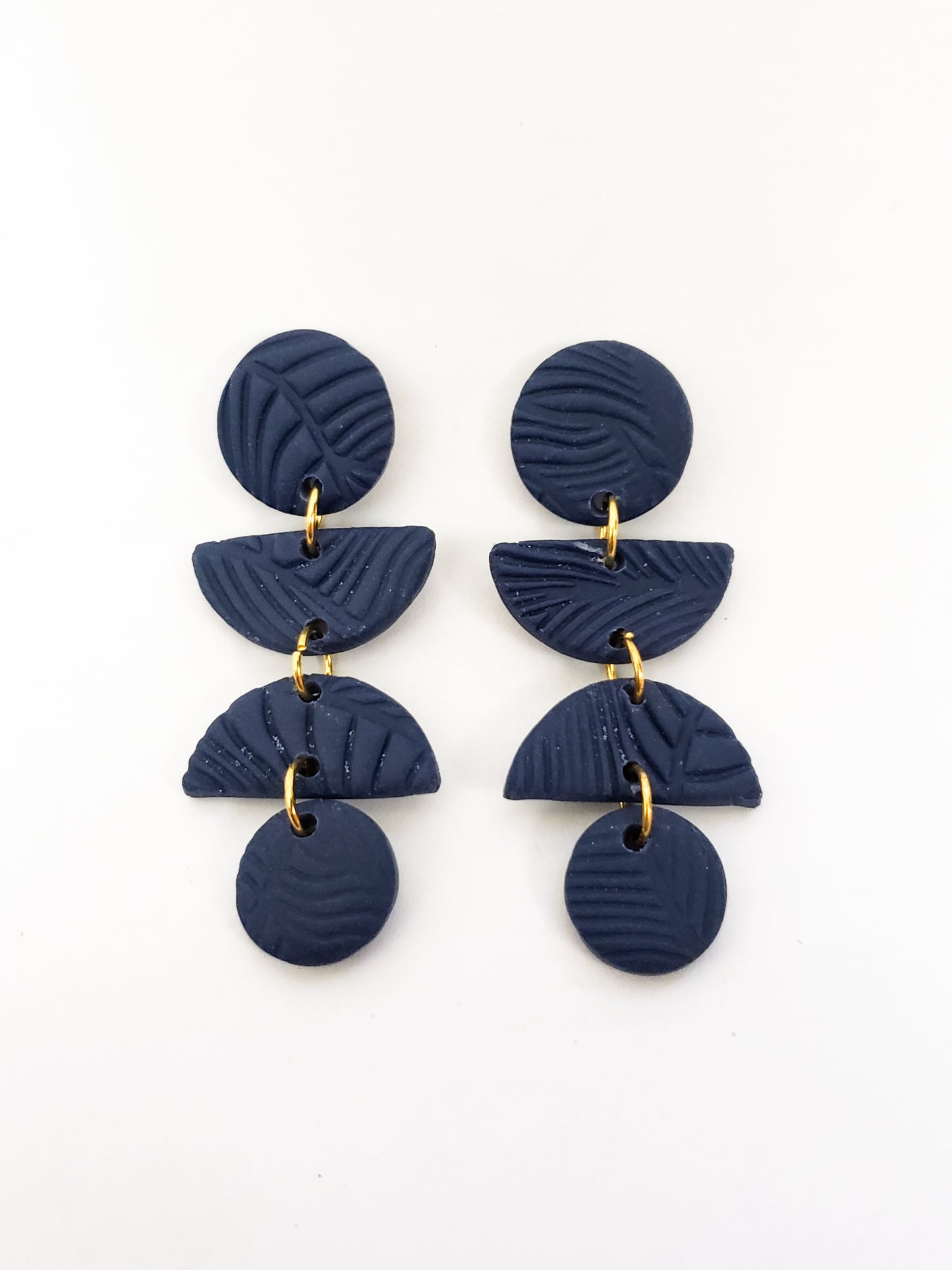 Leafy line textured stud dangles (circle, half circle, half circle, circle) in navy blue