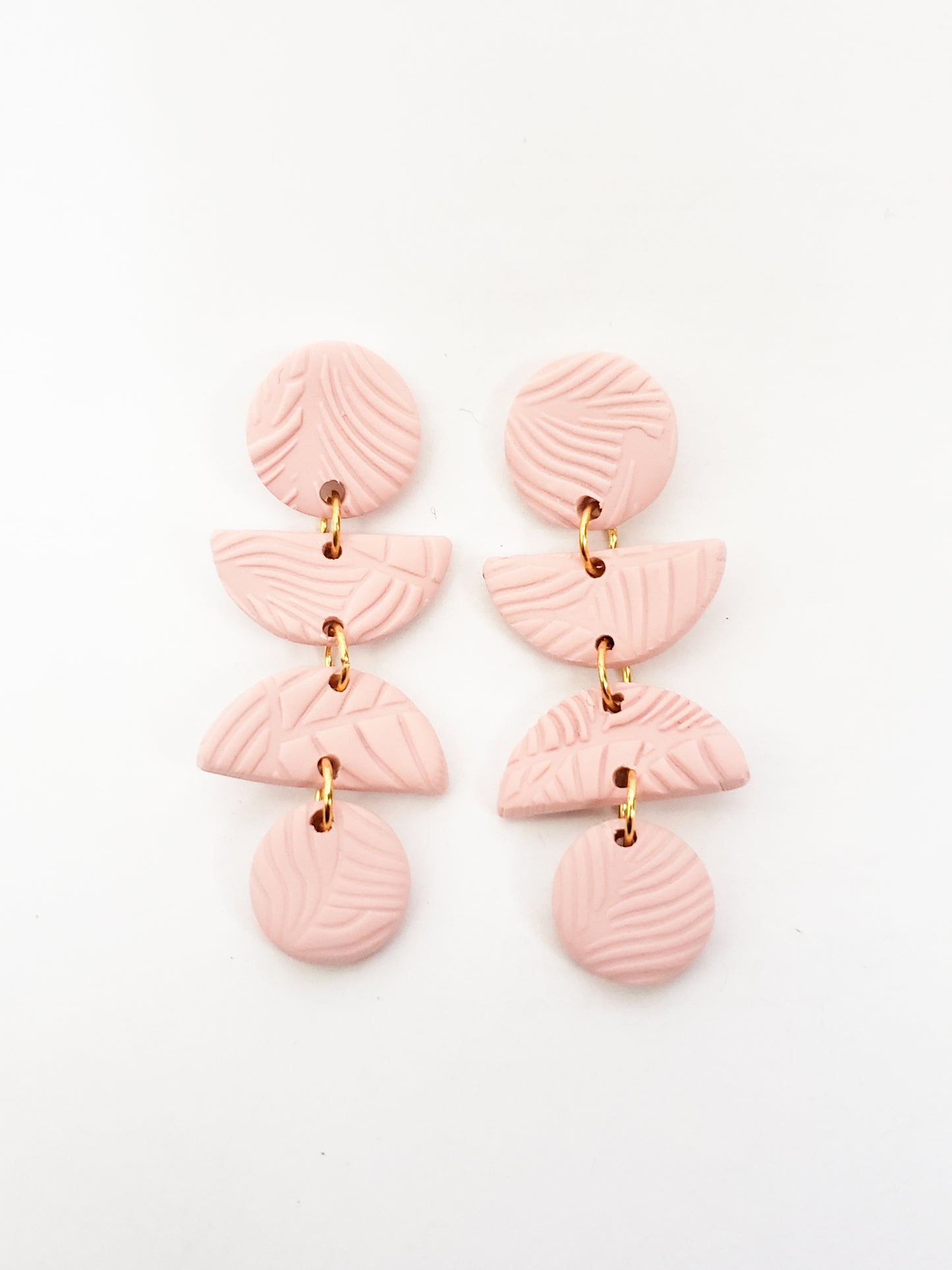 Leafy line textured stud dangles (circle, half circle, half circle, circle) in blush pink