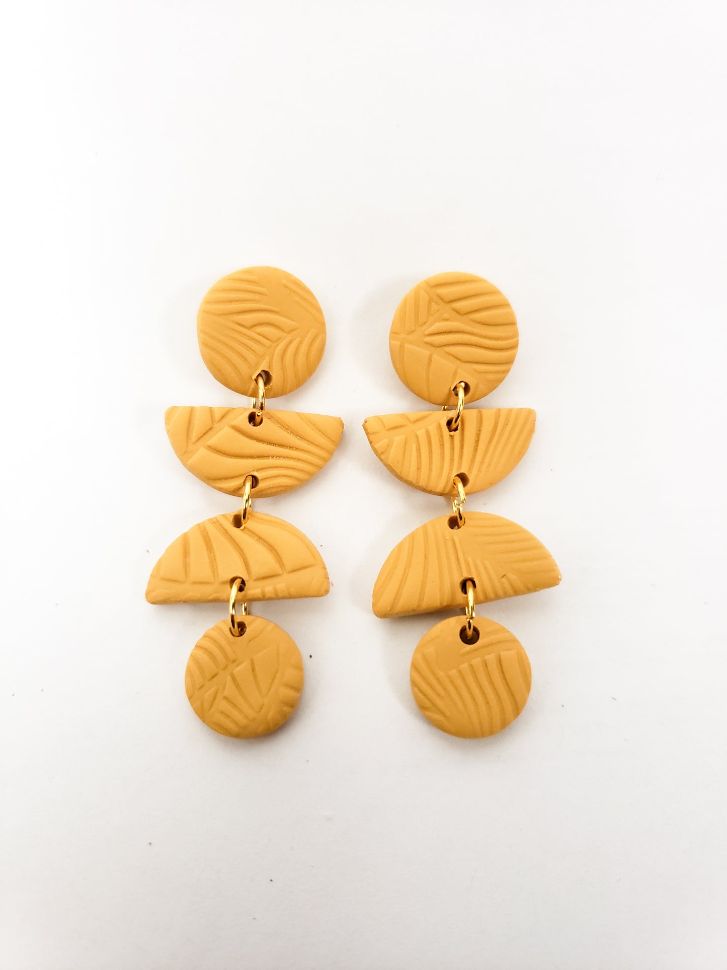 Leafy line textured stud dangles (circle, half circle, half circle, circle) in mustard yellow