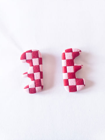 Textured red and light pink checkerboard funky shape studs